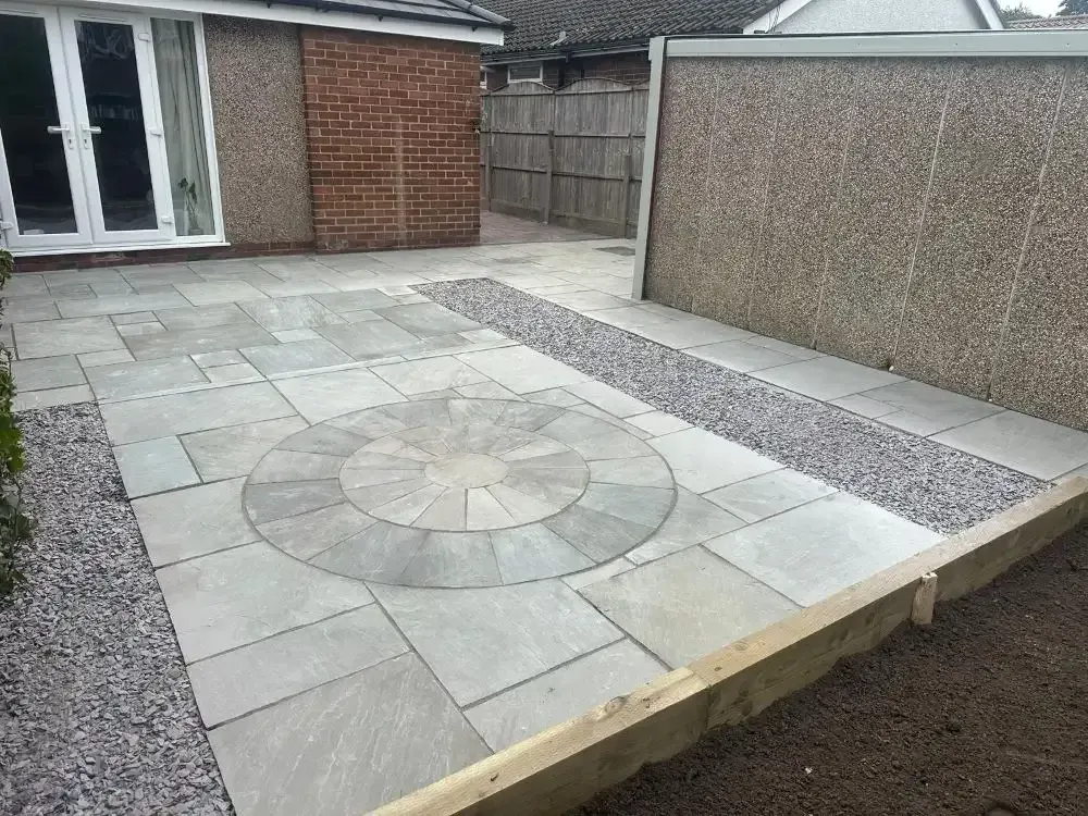 Sandstone circle feature patio with sleeper edge