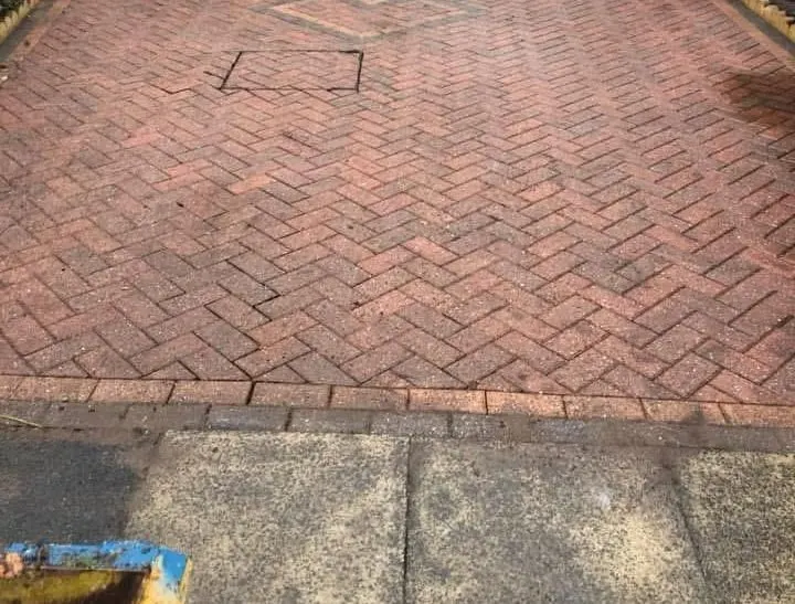 Red herringbone block paved driveway