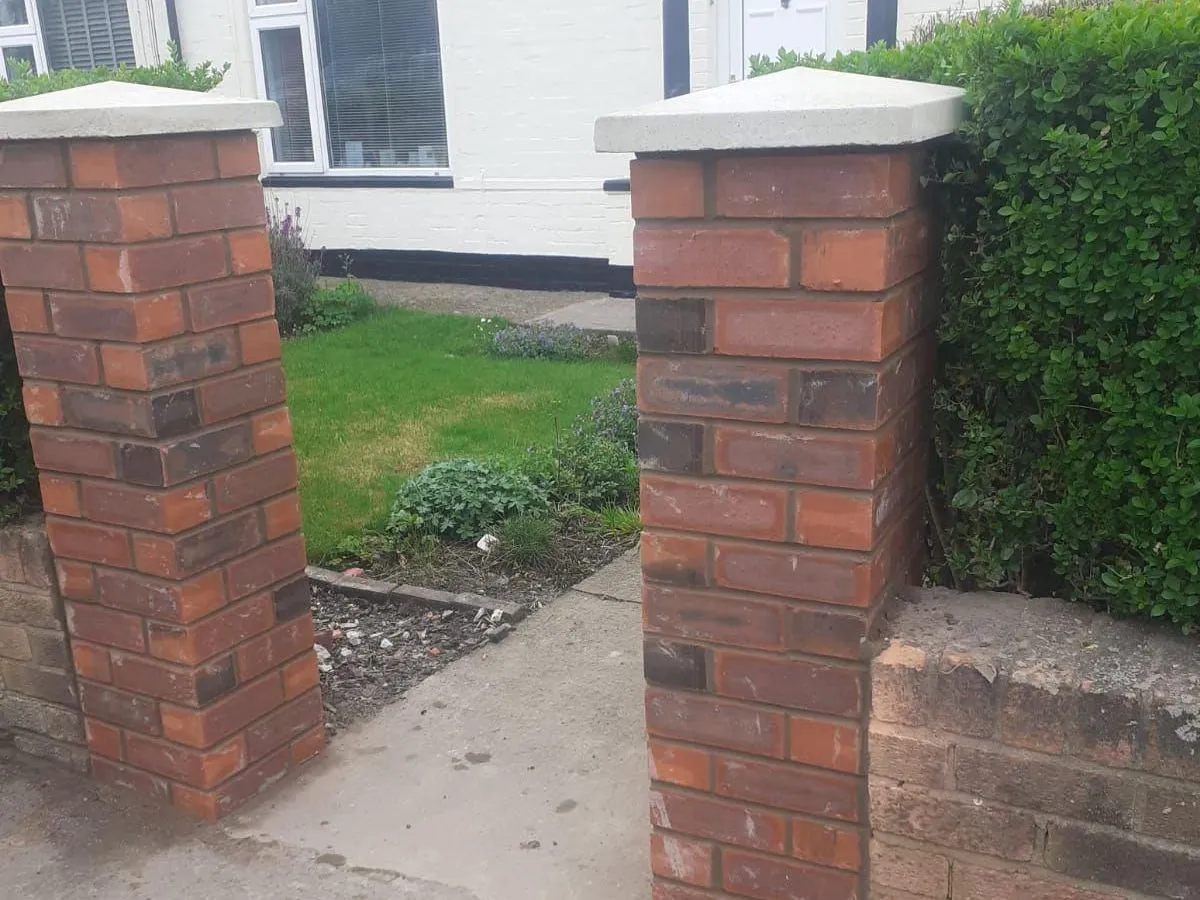New brick gate piers with stone caps