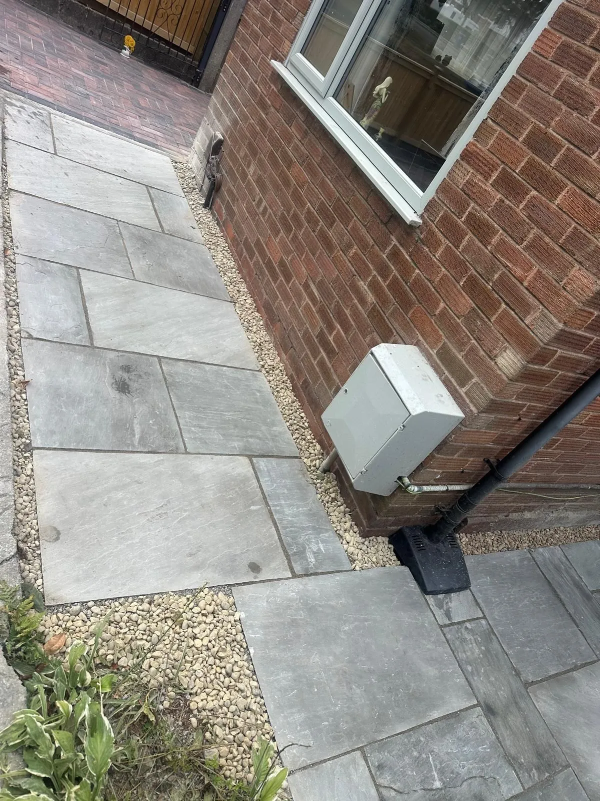Grey sandstone side path with gravel edging