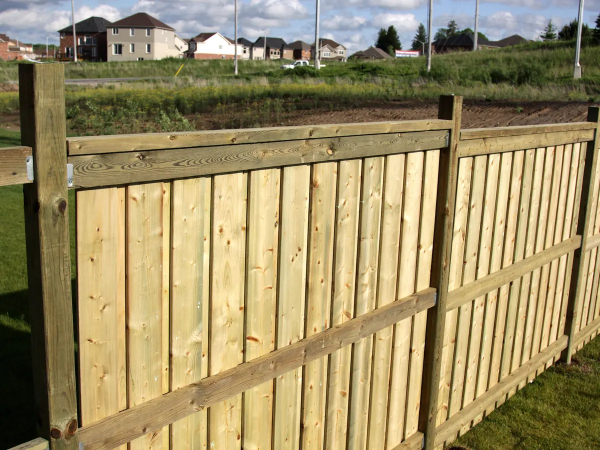 Closeboard fence installed along a garden boundary