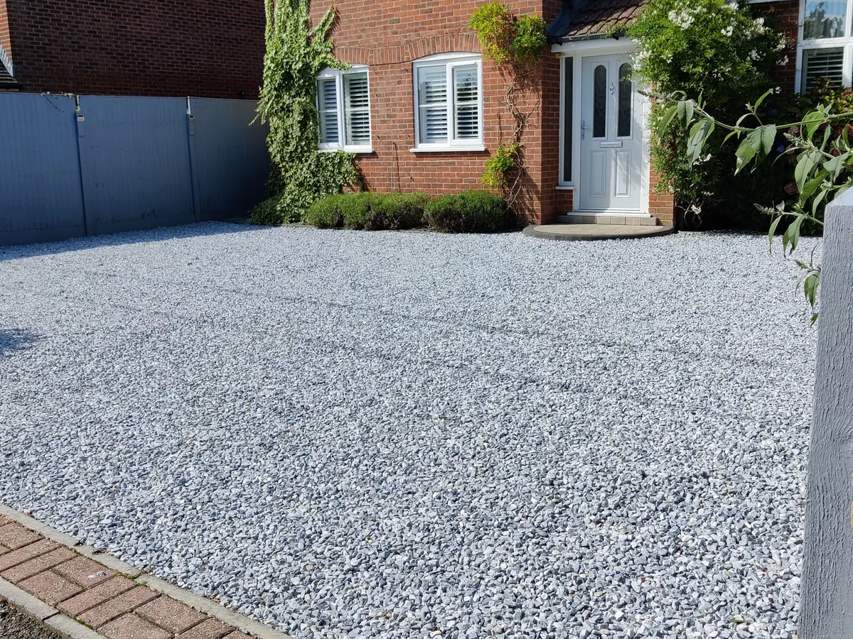Grey shingle driveway with block edging