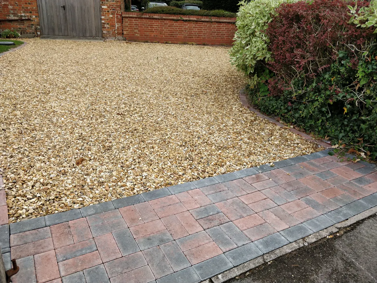 Gravel driveway with a block paved apron