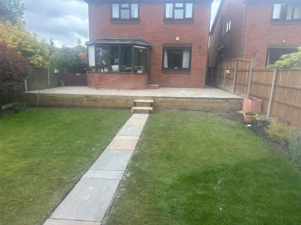 Newly turfed lawn with a stepping stone path in a Manchester garden